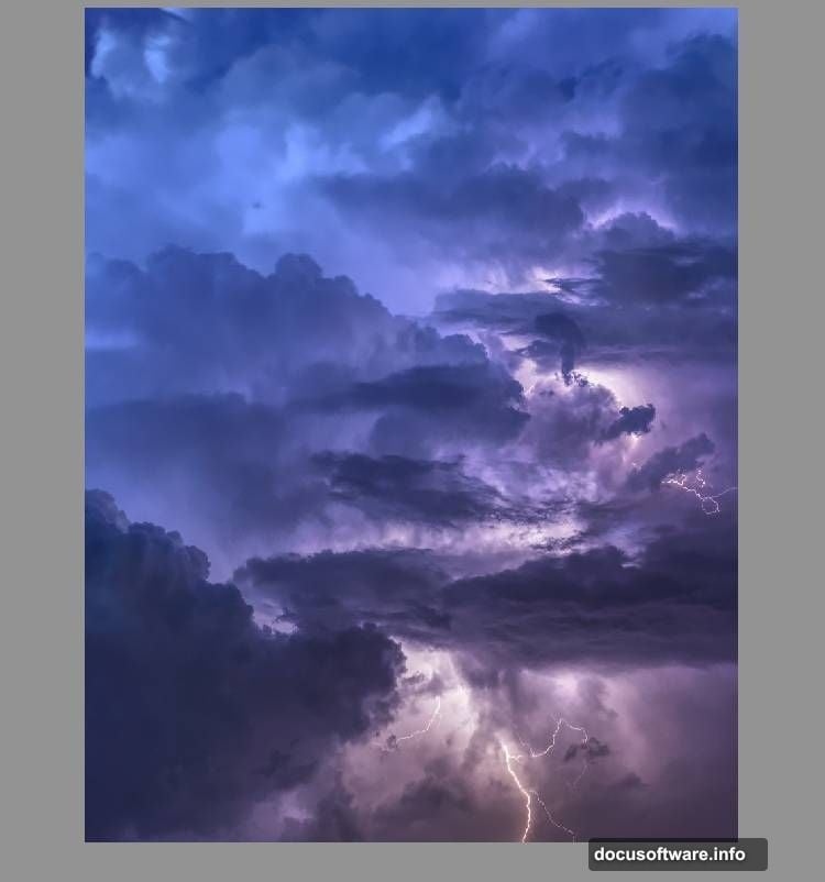 Layer mask with soft black brush blends sky seamlessly with background