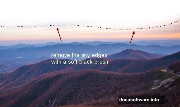 Soft black brush at one hundred percent opacity removes transitions