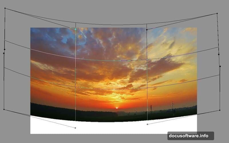 Free Transform Warp mode bends sky image to dramatic horizon shape